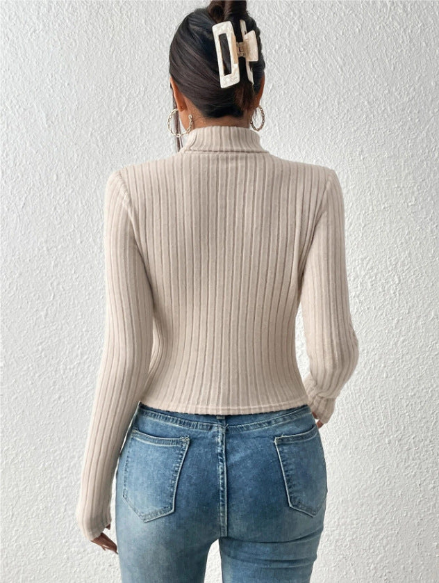 Women’s beige cut-out ribbed knit top with mock neck – trendy long sleeve fitted sweater for chic fall fashion.