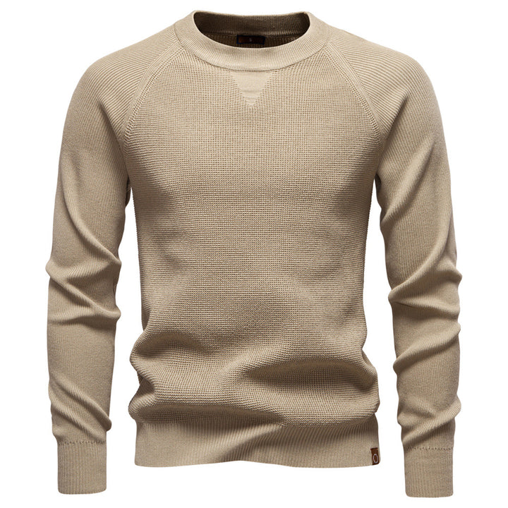 Beige sweater on a white background