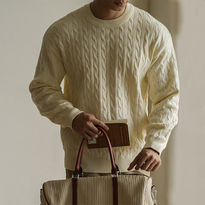 Men's cream cable-knit crew neck sweater styled for fall and winter. Chunky knit pullover ideal for cozy and casual outfits.