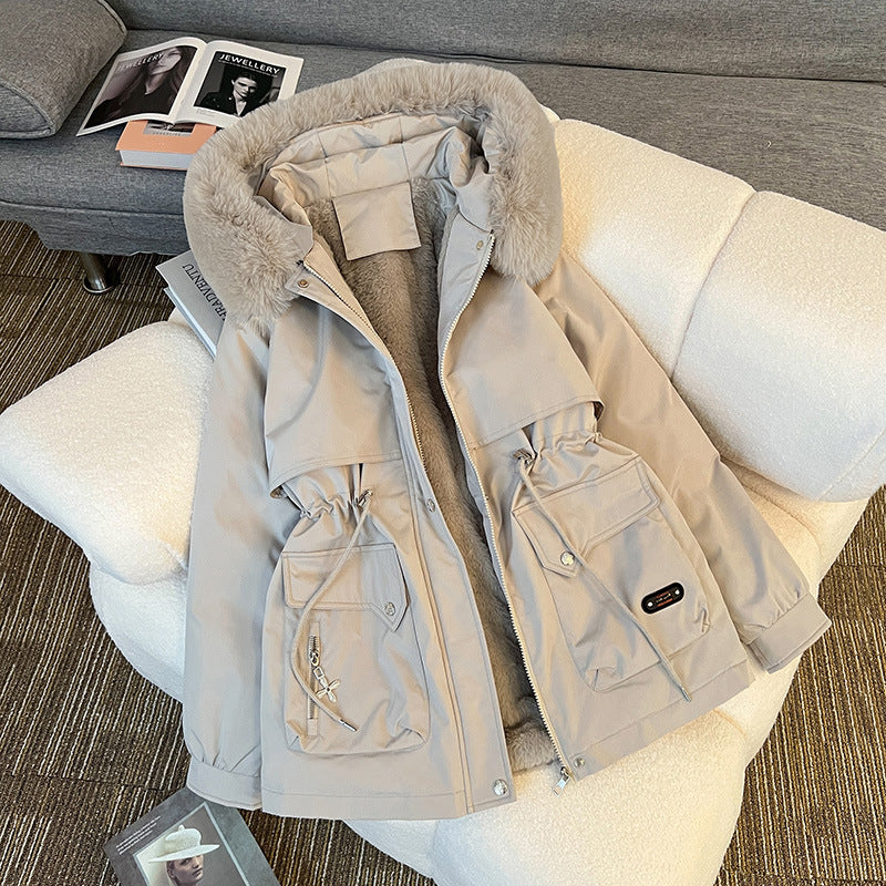 Warm fur-lined winter jacket for women in beige – stylish utility parka with multiple pockets for cold-weather outfits.