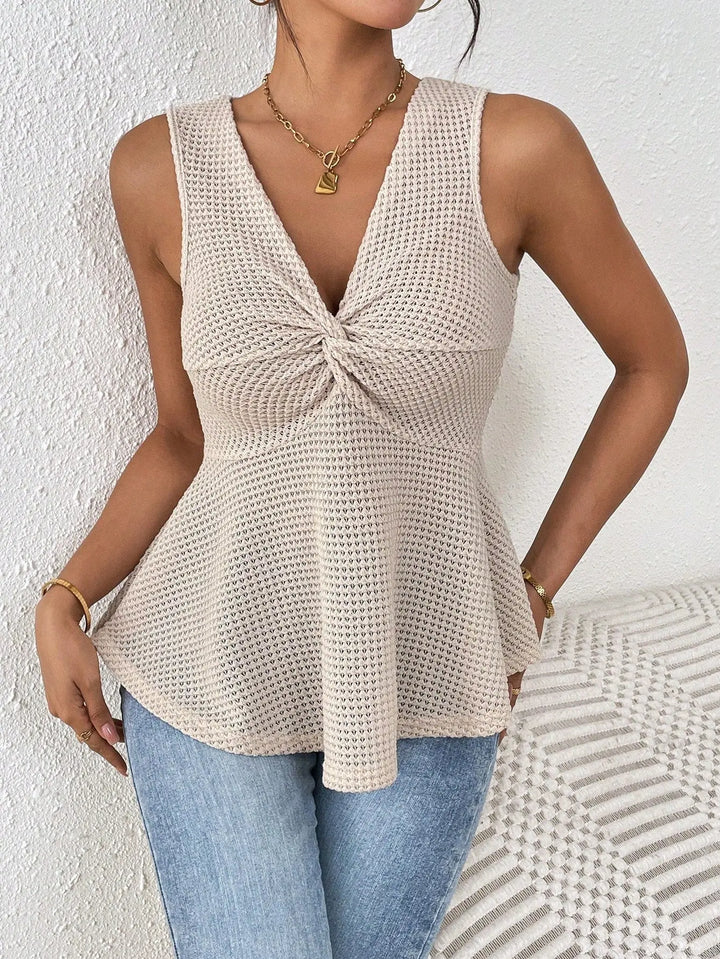 Women’s beige sleeveless knit peplum top with twisted front detail – casual summer fashion