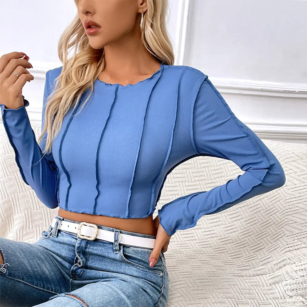 Trendy sky blue long sleeve crop top for women with vertical seam detailing, ideal for casual streetwear or going out.