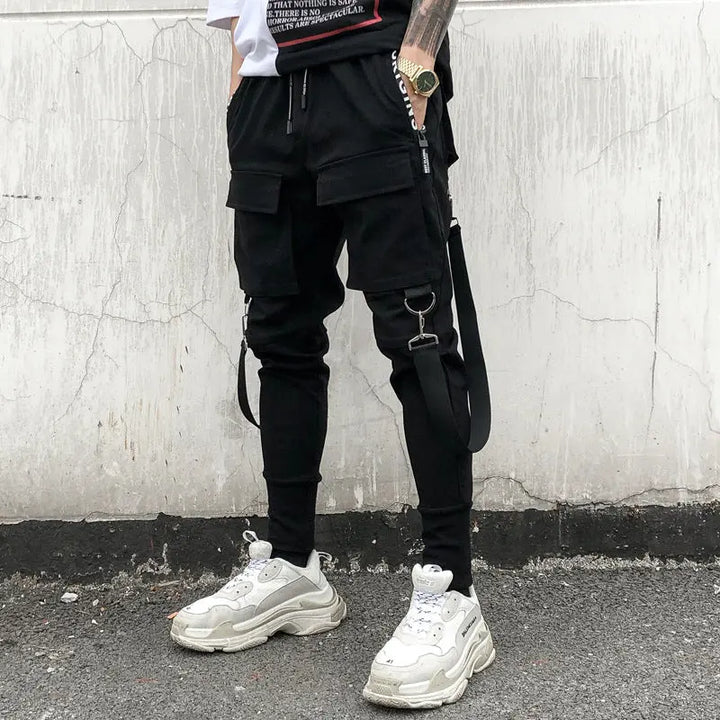 Men’s black streetwear cargo joggers with zipper pockets and straps – urban utility pants