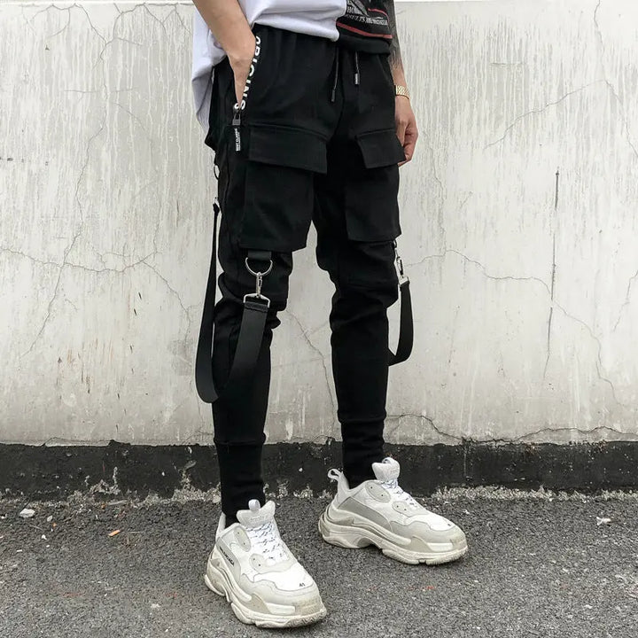 Men’s black streetwear cargo joggers with zipper pockets and straps – urban utility pants