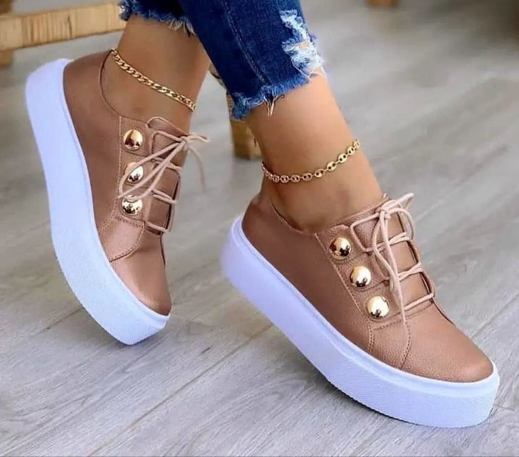 Brown sneakers with gold accents