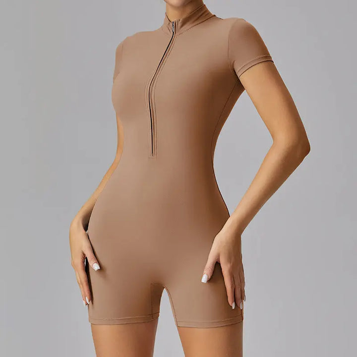 Women’s beige short sleeve zip-up romper with bodycon fit – sporty and sleek one-piece activewear