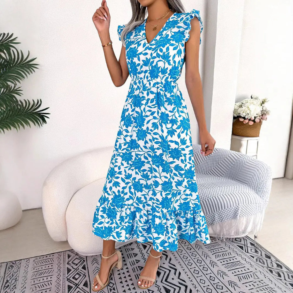Women’s blue floral midi dress with white flower print, flutter sleeves, V-neckline, and ruffle hem – elegant summer outfit
