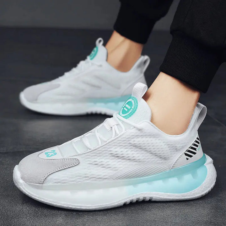 A pair of SleekMotion Running Sneakers with white color scheme, showcasing the mesh upper and cushioning sole.