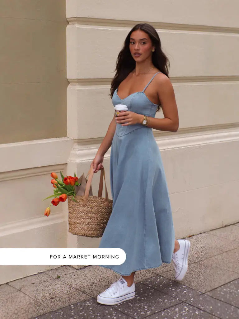 Woman in a light blue denim dress 