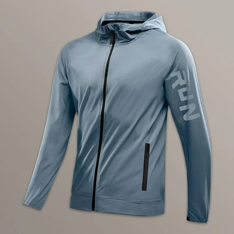 Men’s light blue zip-up running jacket with hood and 'RUN' sleeve print – breathable activewear outer layer