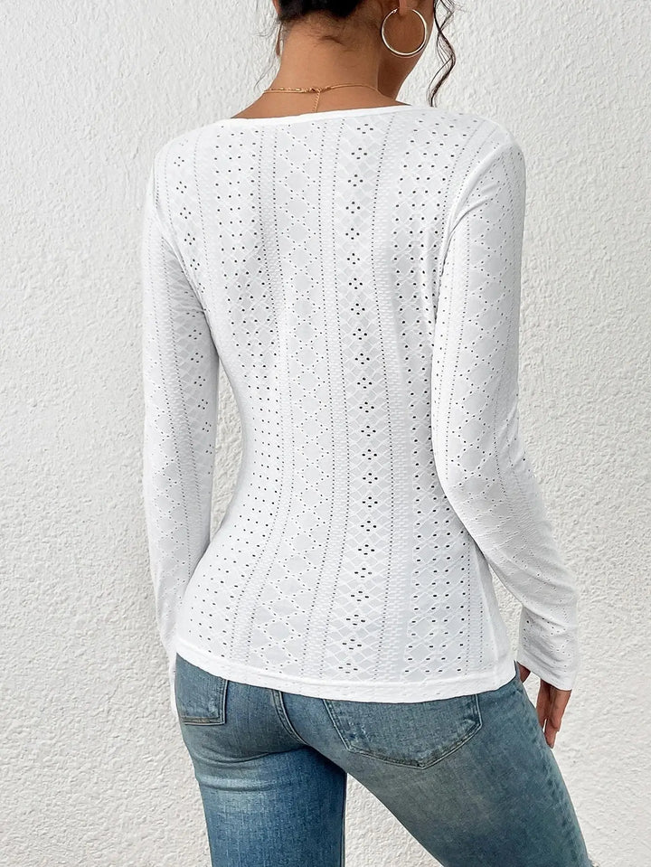 Women's white long-sleeve top with eyelet details