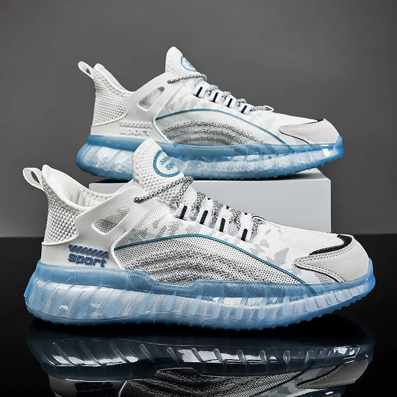A pair of white and blue AllMotion Active Shoes with a breathable upper design and a non-slip rubber outsole, displayed against a grey background.