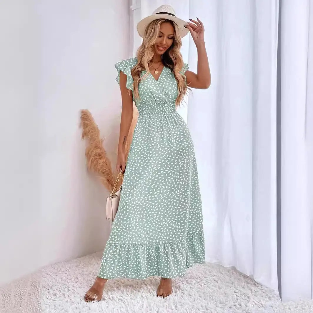Women’s green maxi dress with white polka dot print, flutter sleeves, and ruffle hem – elegant summer boho fashion
