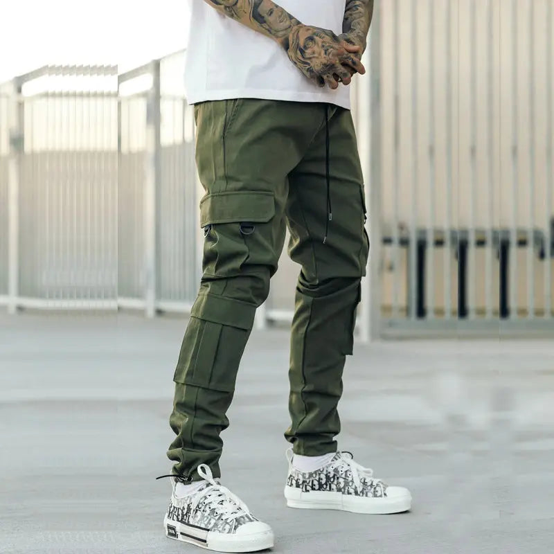 Olive green urban cargo pants for men with multiple zipper pockets – street style