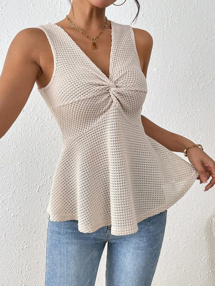 Women’s beige sleeveless knit peplum top with twisted front detail – casual summer fashion