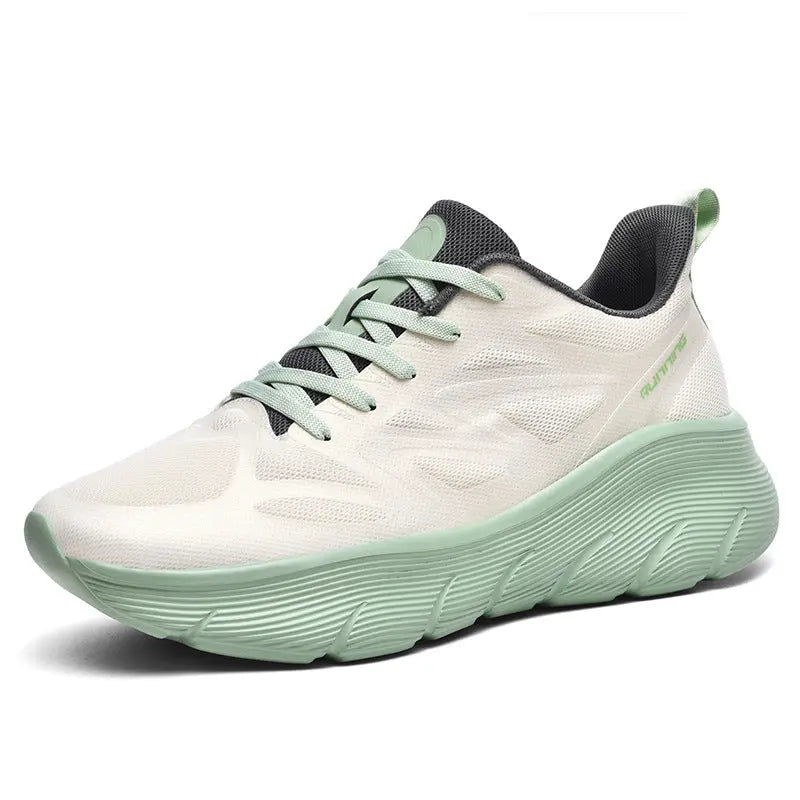 A pair of white and green ActiveGlide Sports Shoes placed on a pedestal, showcasing the sole design
