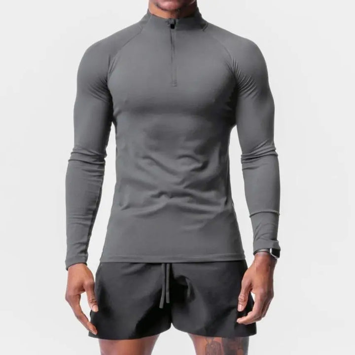 Gray men’s performance long-sleeve athletic top with zipper neck – breathable and sweat-wicking fabric