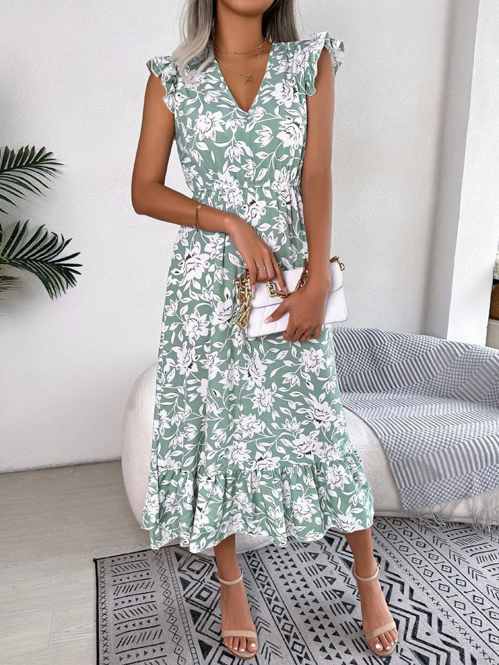 Women’s green floral midi dress with white flower print, flutter sleeves, V-neckline, and ruffle hem – elegant summer outfit