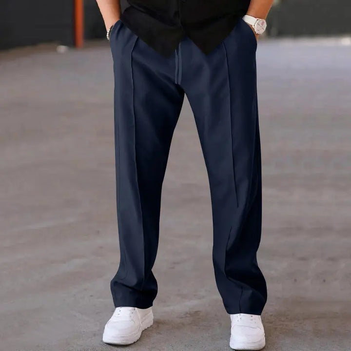 Dark navy wide-leg trousers with relaxed waist and minimal pleats – versatile business casual pant for men
