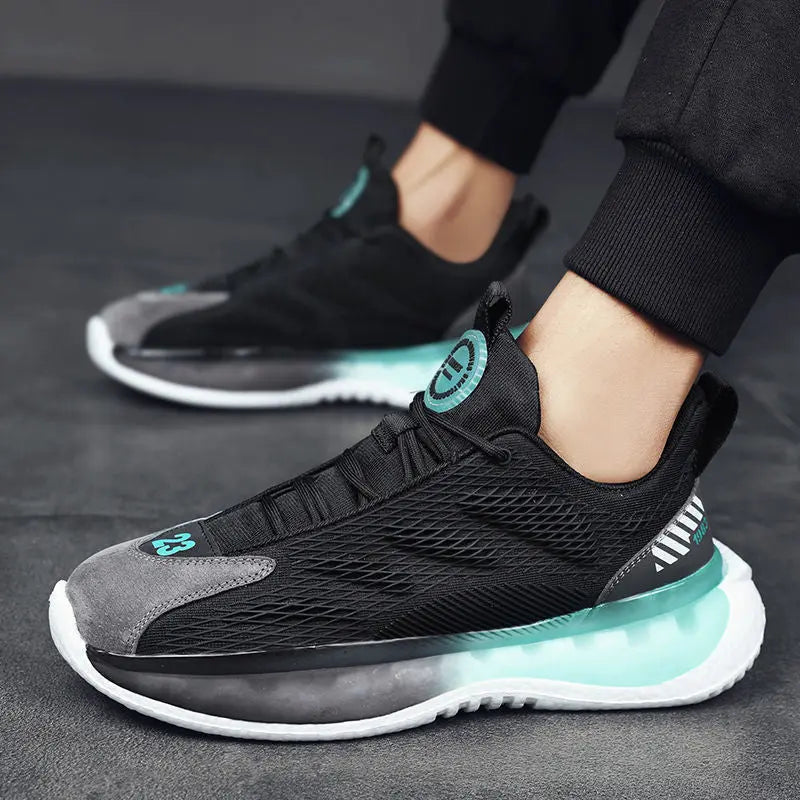 A pair of SleekMotion Running Sneakers with a black, grey, and green color scheme, showcasing the mesh upper and cushioning sole.