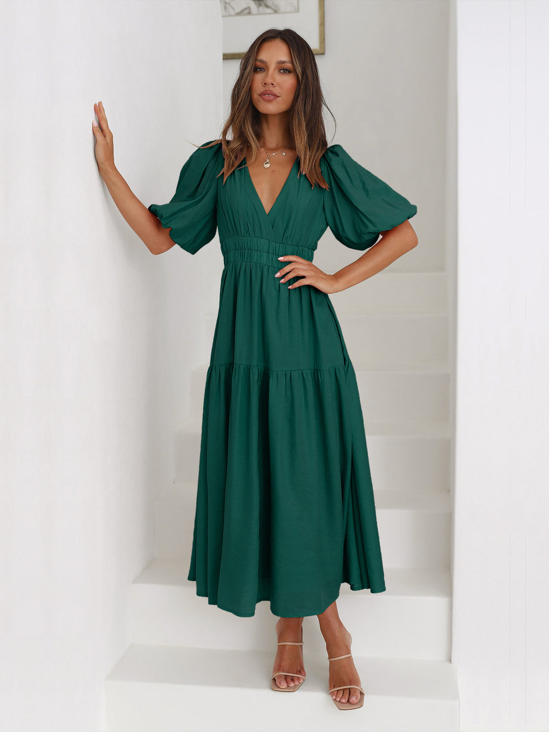 Green V-neck midi dress with short sleeves – flowy and flattering silhouette for chic summer fashion.