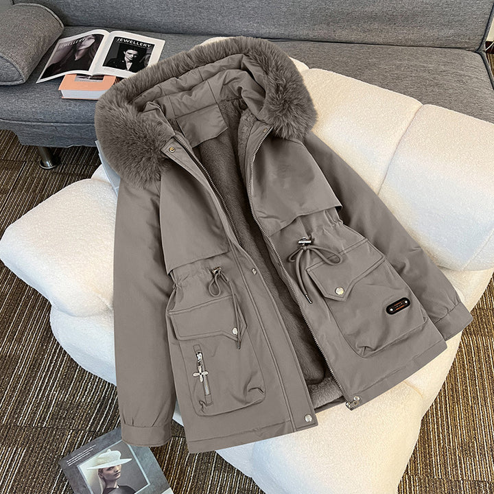 Warm fur-lined winter jacket for women in grey – stylish utility parka with multiple pockets for cold-weather outfits.