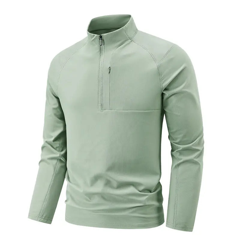 A light green SportZip Active Tee with a half-zip design and long sleeves.