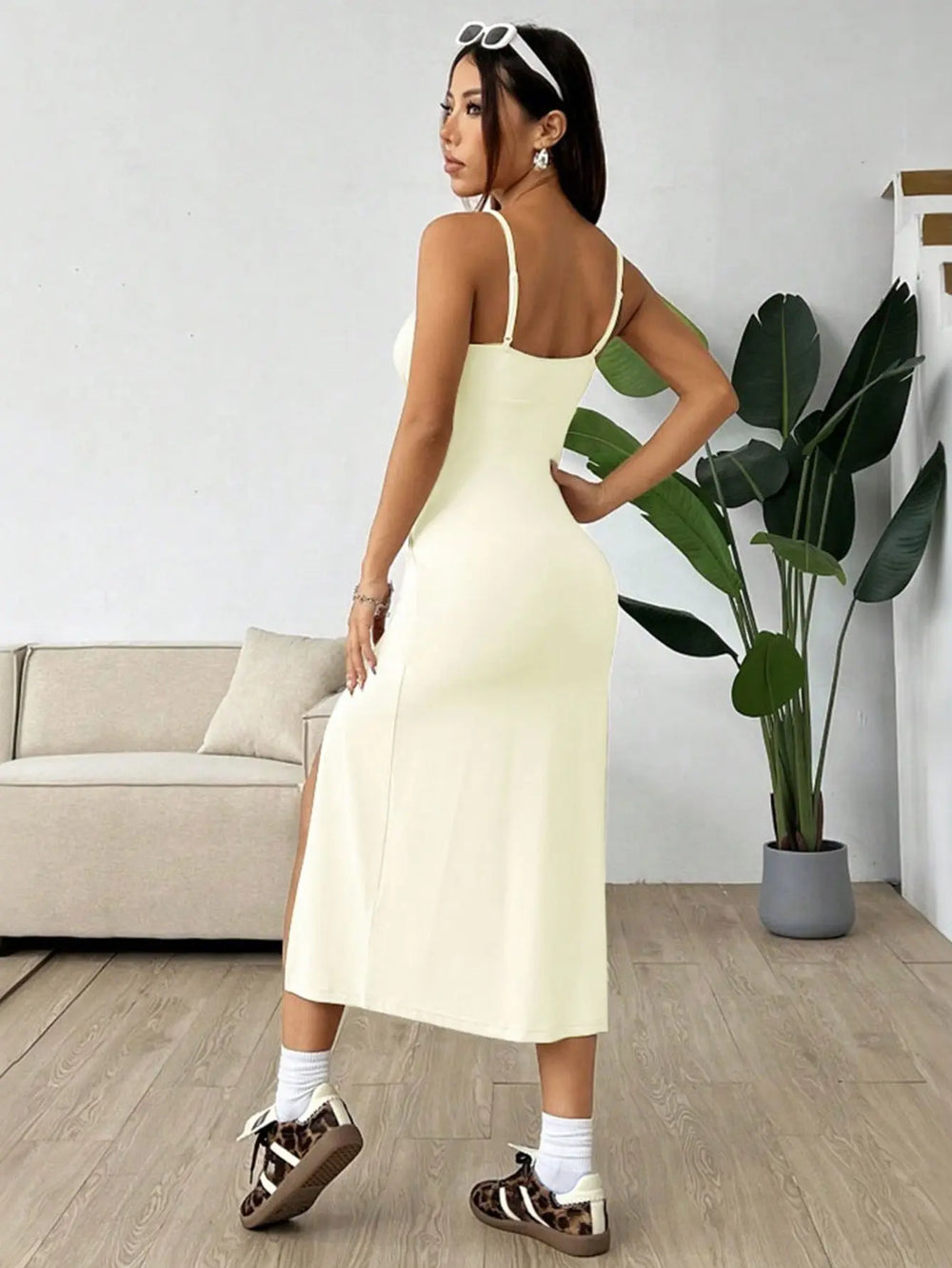 Women’s pastel yellow midi dress with spaghetti straps, ruched bust, and thigh-high side slit – elegant summer outfit