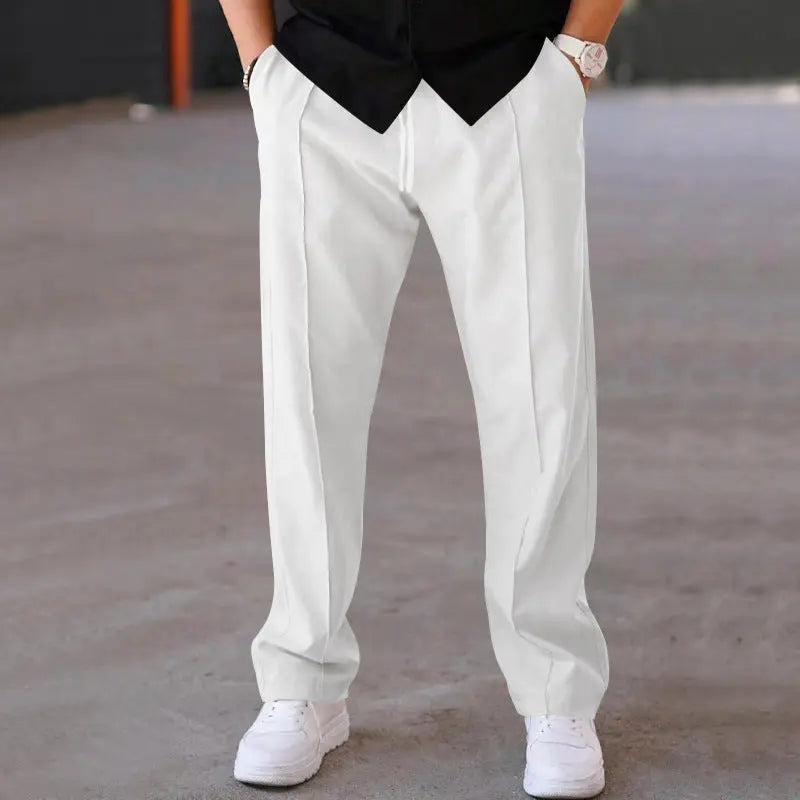 Crisp white wide-leg dress pants for men with clean silhouette and soft drape – elevated modern menswear essential