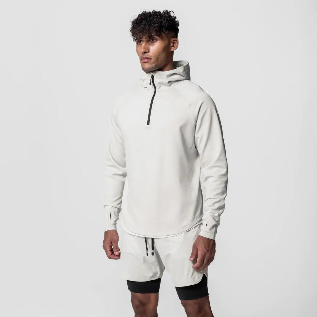 White men’s pullover hoodie with zipper neck and tapered fit – ideal for layering in athletic or casual outfits