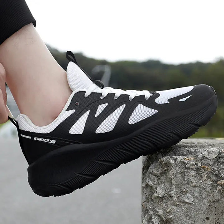 Breathable white mesh athletic sneakers with black and white outsole, ideal for running, walking, and everyday activewear.