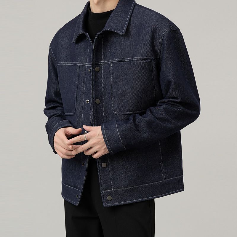 Men’s dark blue classic denim jacket with clean stitched detailing – minimalist casual outerwear for modern everyday looks.