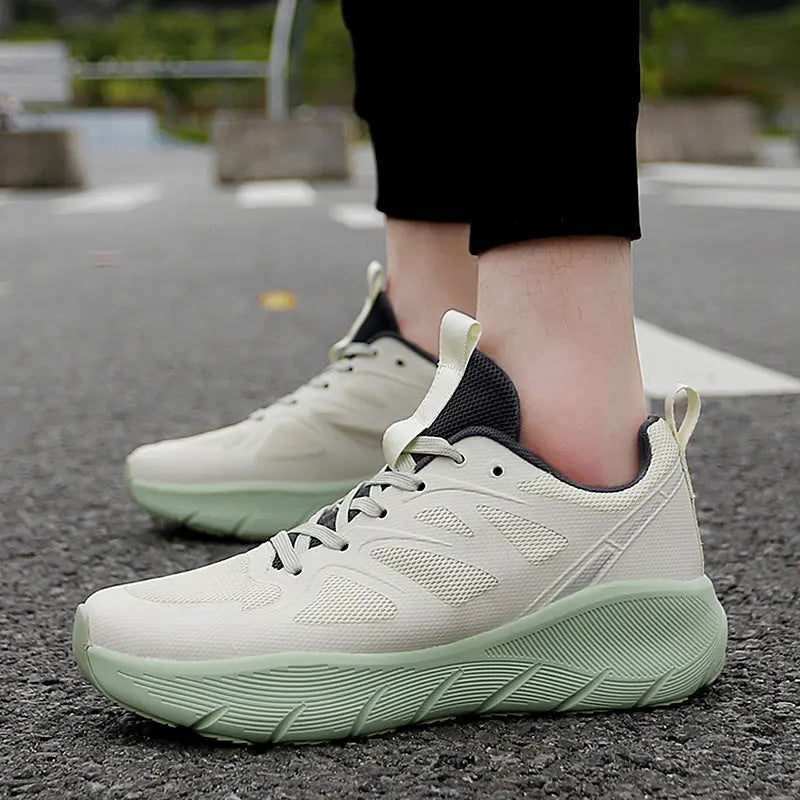Breathable white mesh athletic sneakers with mint green outsole, ideal for running, walking, and everyday activewear.
