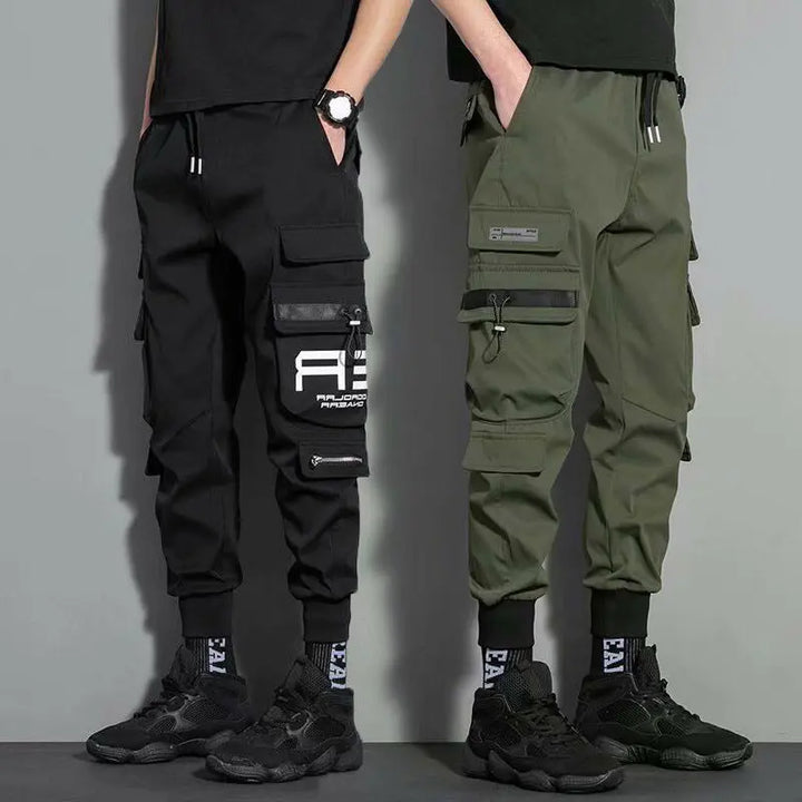 Men's black and olive green cargo joggers with zipper pockets – streetwear utility pants for casual outfits