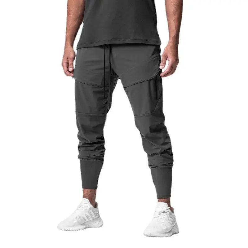 Men’s dark grey tactical sweatpants with multiple zippered pockets – functional joggers for training or casual wear