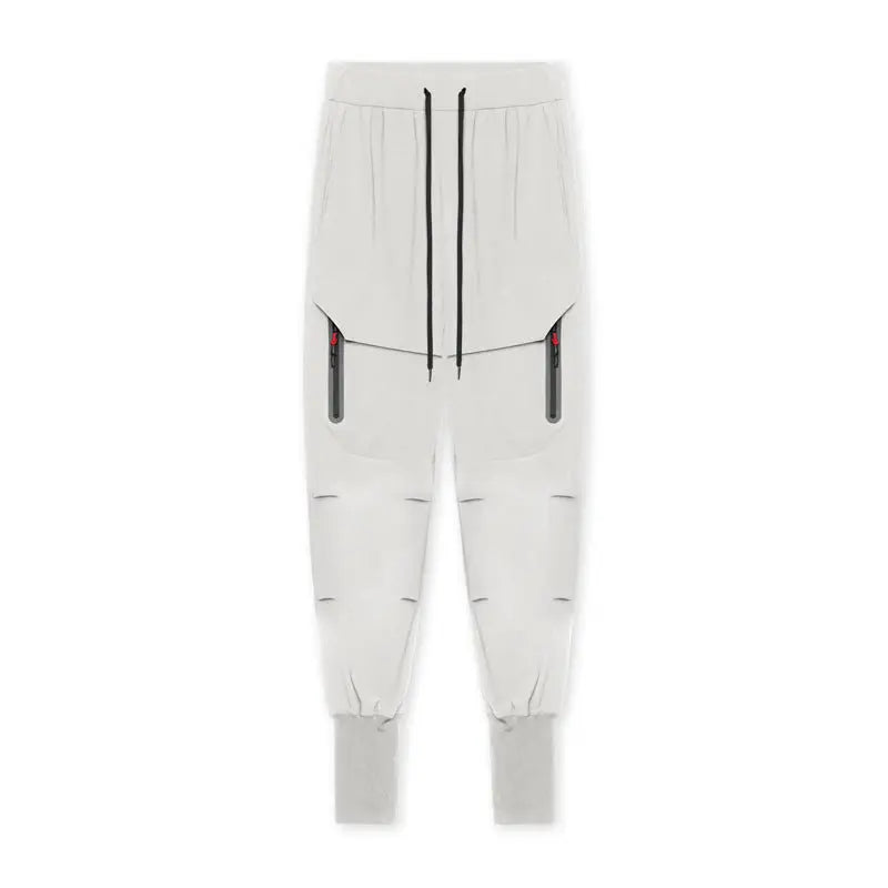 Flat lay of light grey men’s active cargo joggers with zip pockets – ideal for gym sessions and casual outings