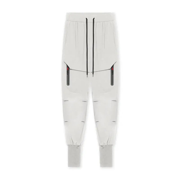 Flat lay of light grey men’s active cargo joggers with zip pockets – ideal for gym sessions and casual outings