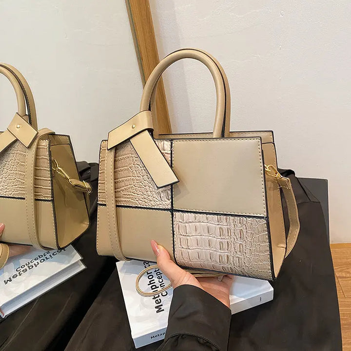 Trendy beige patchwork handbag for women featuring croc-embossed leather texture and detachable shoulder strap.