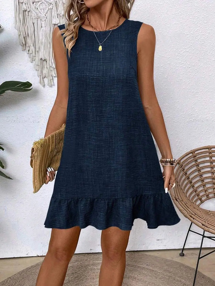 Women’s navy blue sleeveless mini dress with ruffle hem, round neckline, and relaxed fit – casual summer beach dress