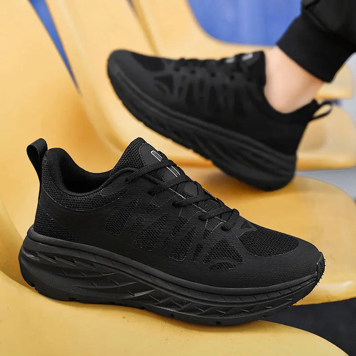 A pair of black PureFit Sports Shoes
