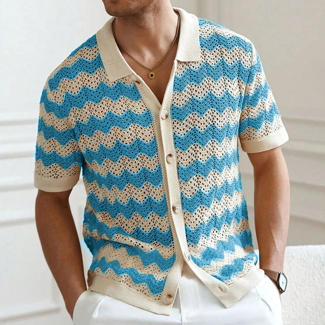 Person wearing a blue and beige striped knitted cardigan