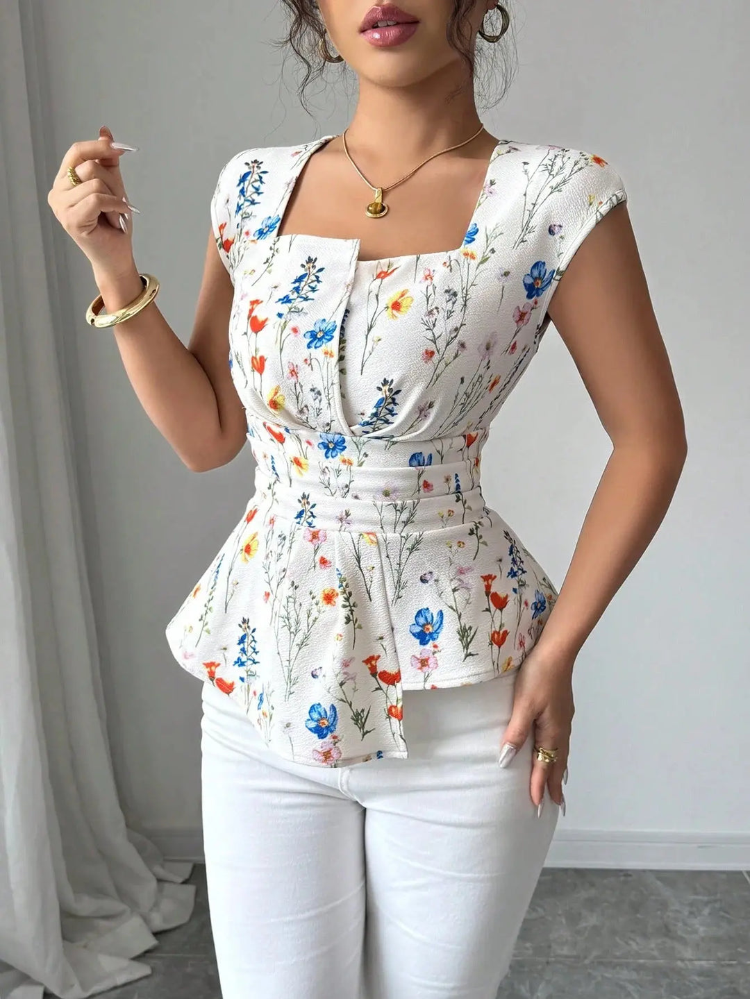 Woman wearing a floral peplum top