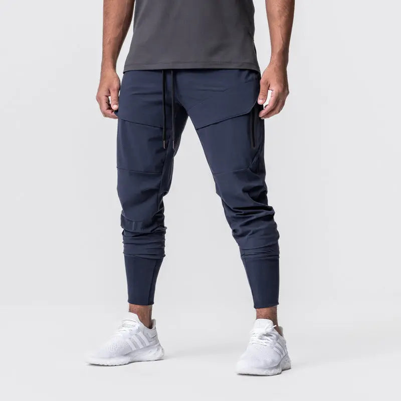 Men’s navy blue cargo jogger pants with tapered ankle cuffs – stylish activewear for gym and street style