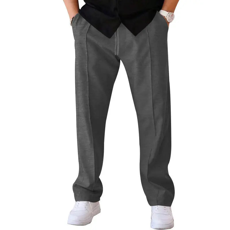 Dark grey (charcoal) wide-leg pants with minimal design – ideal for layering in urban menswear outfits