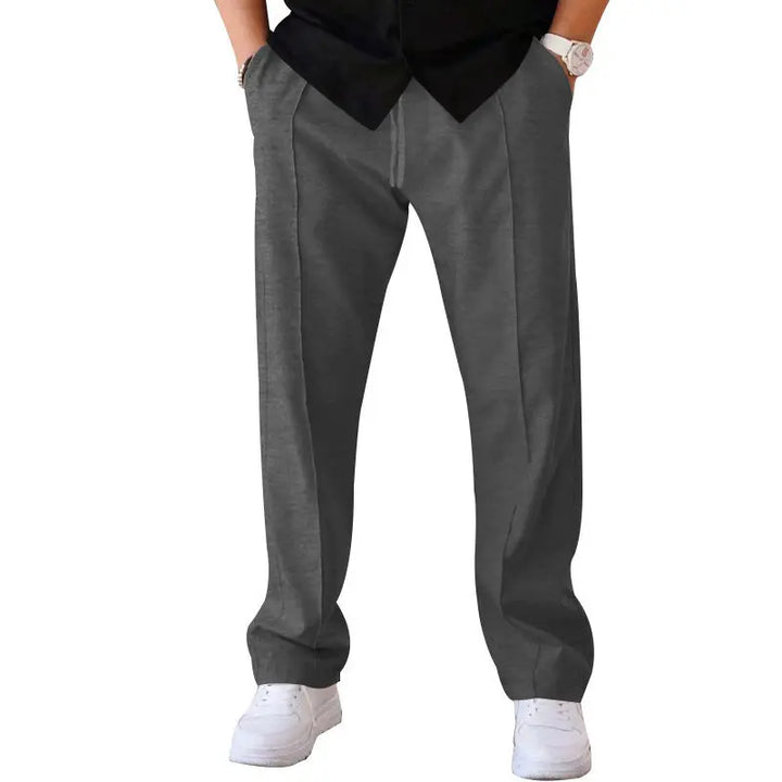 Dark grey (charcoal) wide-leg pants with minimal design – ideal for layering in urban menswear outfits