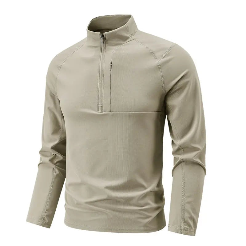 A beige SportZip Active Tee with a half-zip design and long sleeves.