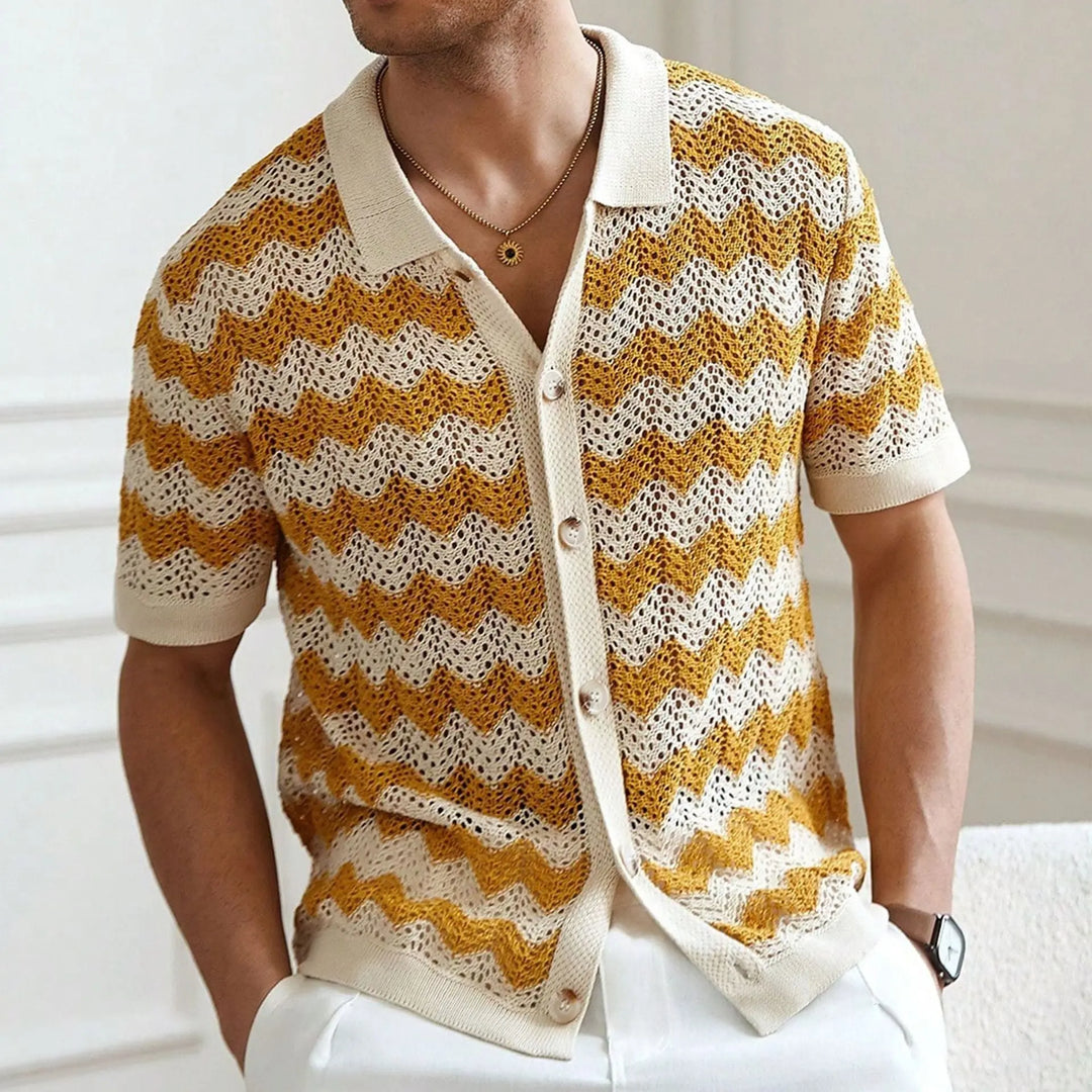 Man wearing a yellow and white patterned cardigan