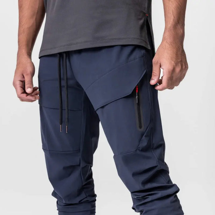 Men’s navy blue cargo jogger pants with tapered ankle cuffs – stylish activewear for gym and street style