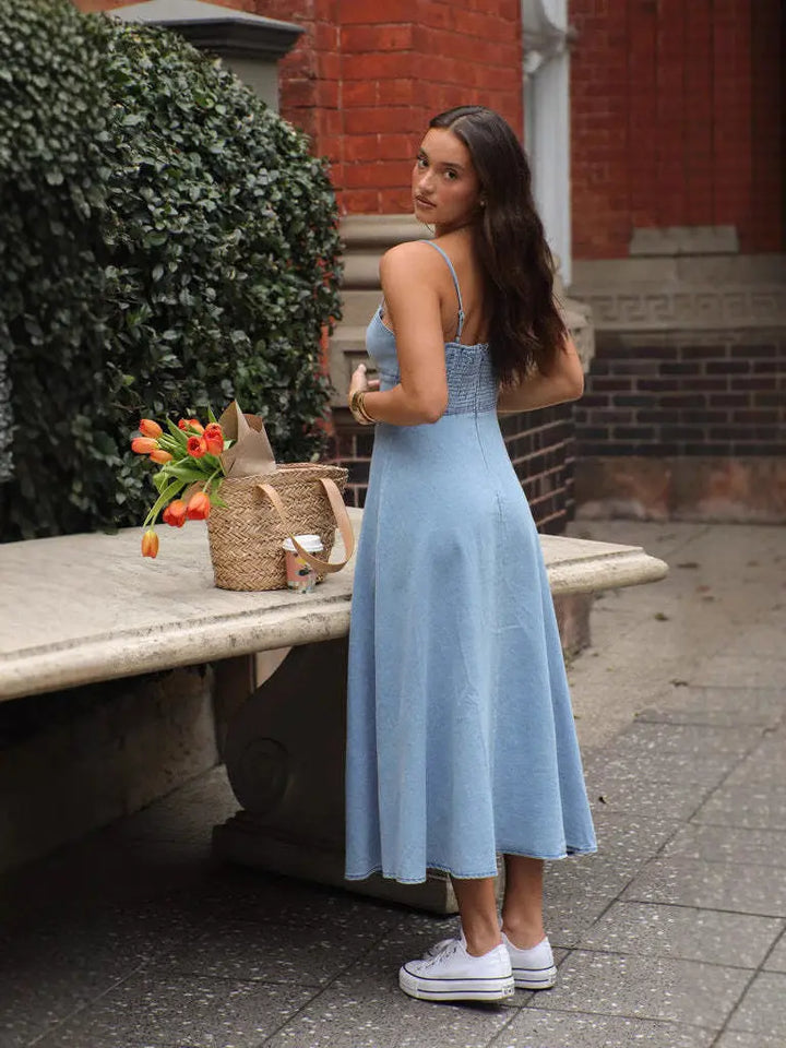 Woman in a light blue denim dress 