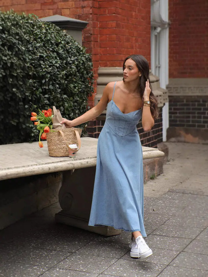Woman in a light blue denim dress 